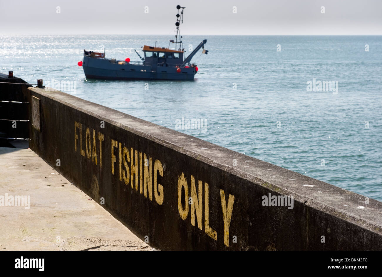 A fishing trawler anchored in the sea off the West arm of Brighton