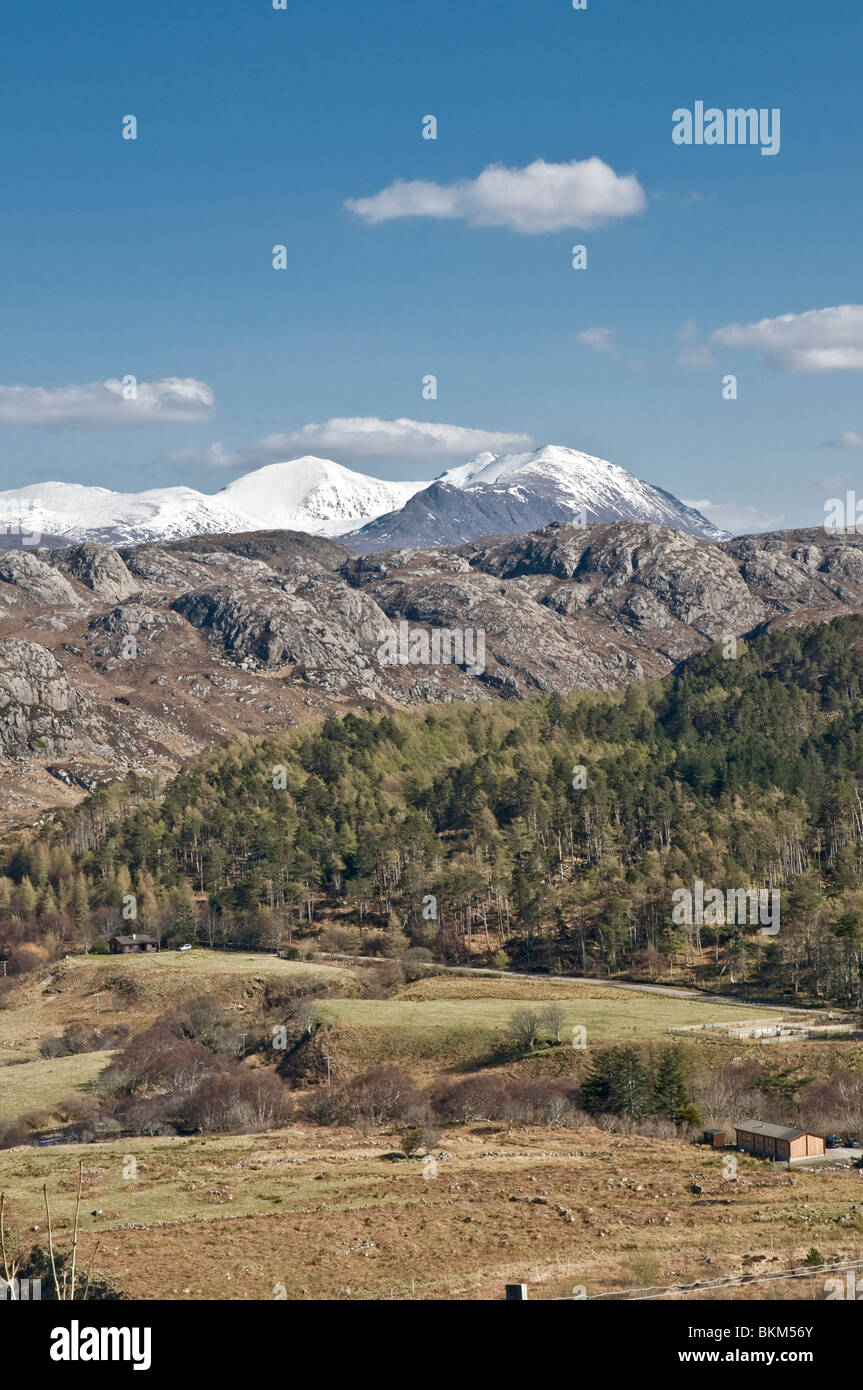 Snow capped mountains above Gruinard Bay nr Laide Ross & Cromarty Highland Scotland Stock Photo