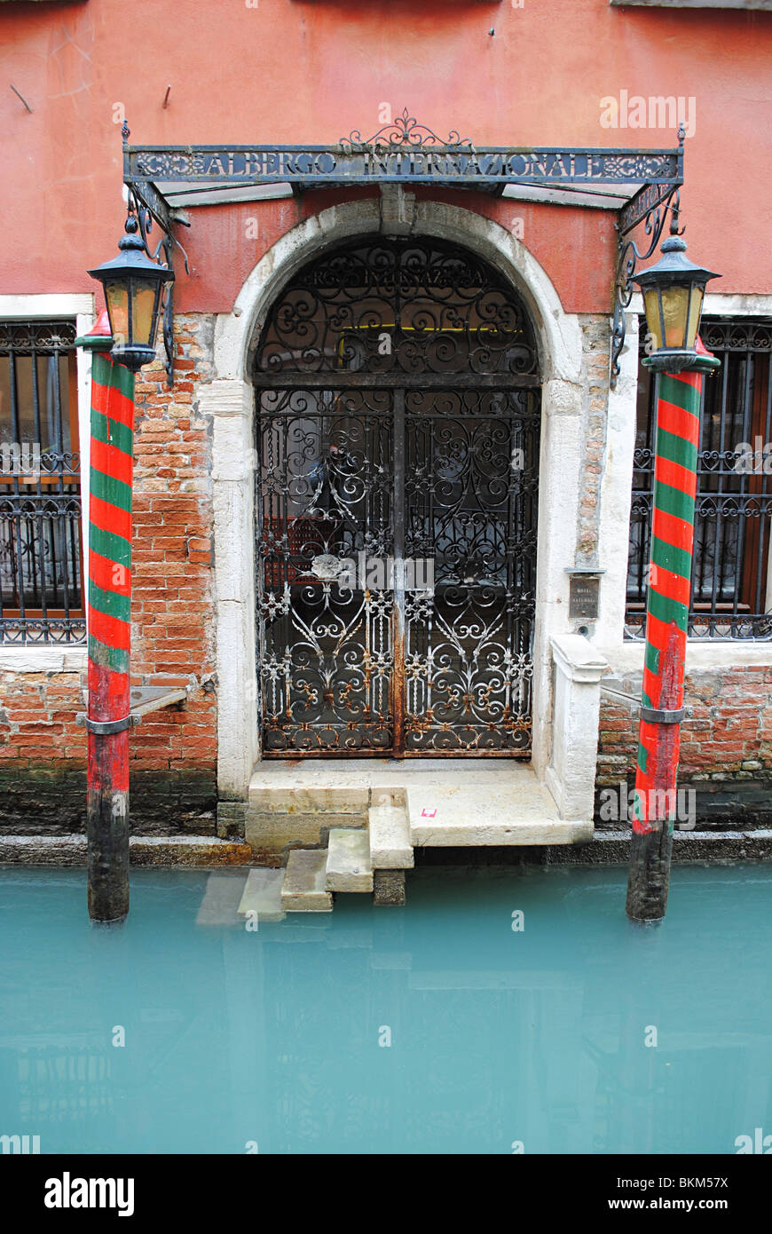Colourful doorway and canal in Venice, Italy Stock Photo