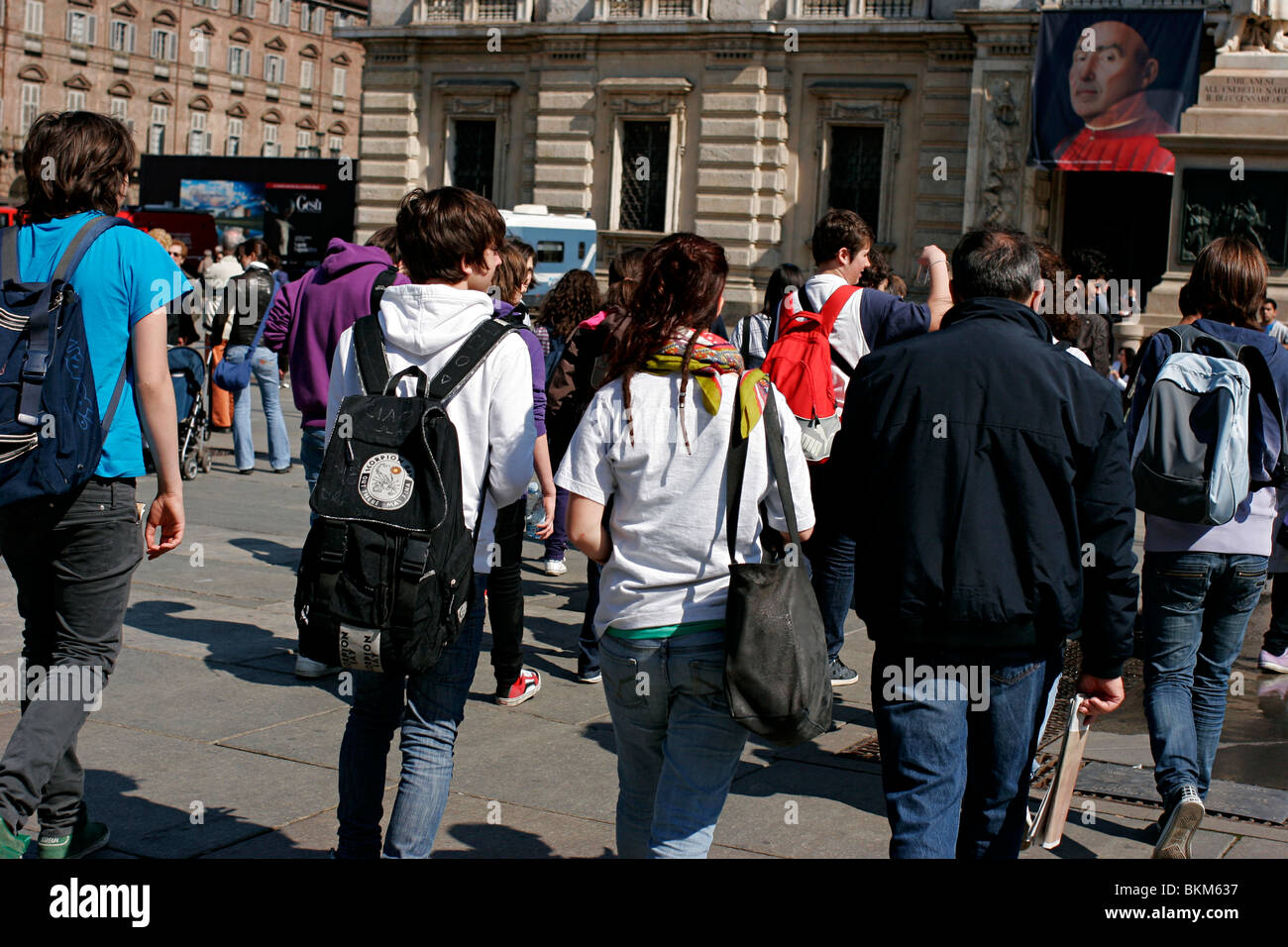 Tourists - Students walking in the Turin downtown. Piazza Castello. Stock Photo