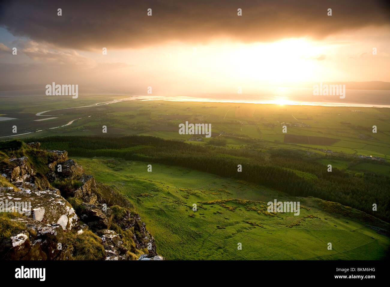 Roe River enters Lough Foyle, clearing summer storm near sunset Stock ...