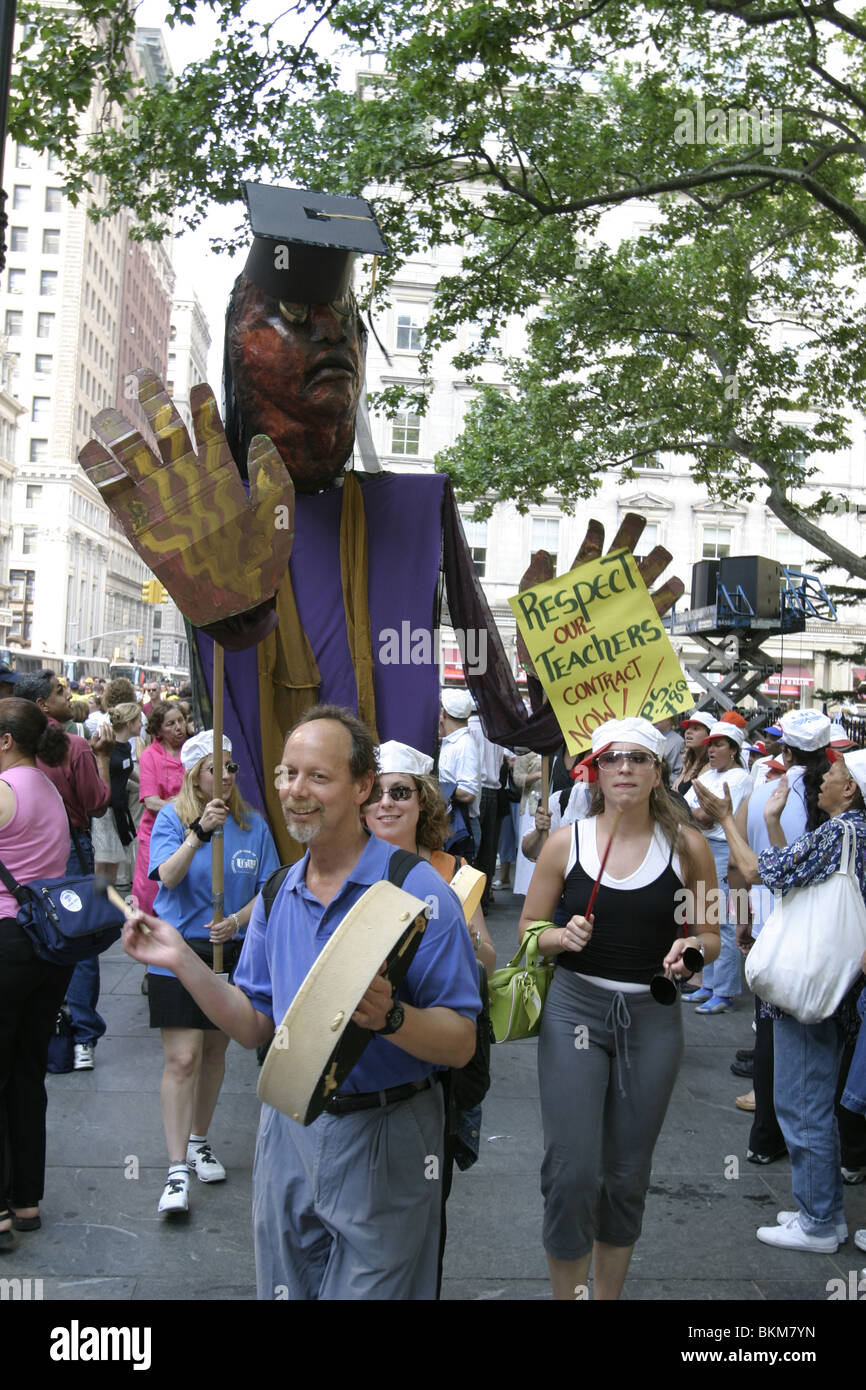 New York City teachers at a union rally for higher wages on Broadway in New York City. Stock Photo