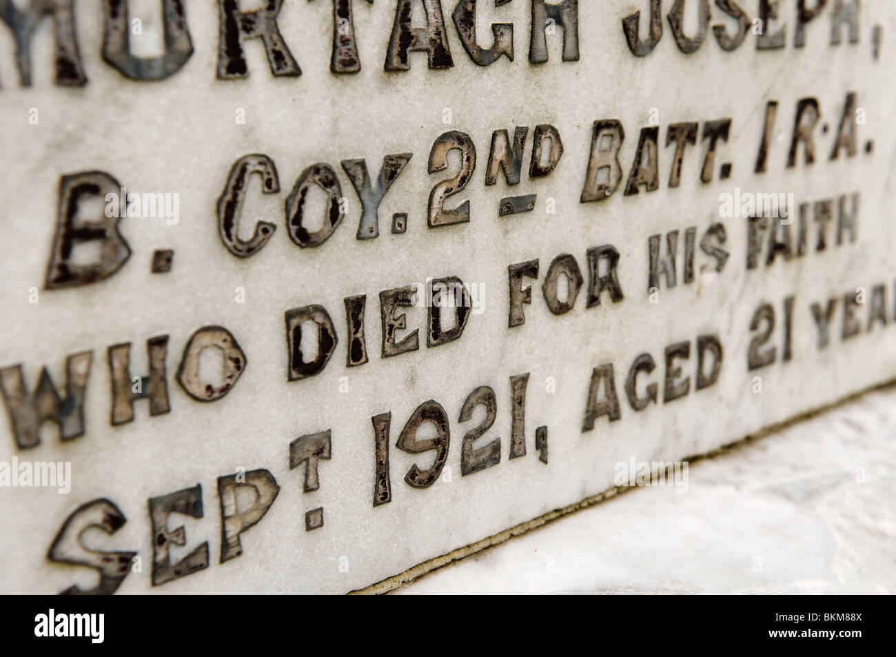 Inscription on a gravestone of an IRA member, killed during the pogroms of the 1920s in Ireland. Stock Photo
