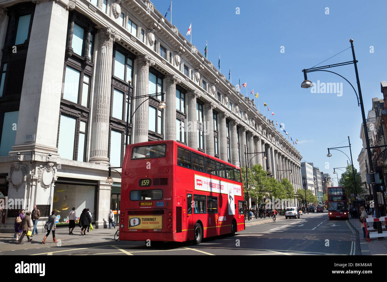 Buses outside Selfridges store on a sunny day in summer, Oxford Street, London UK Stock Photo