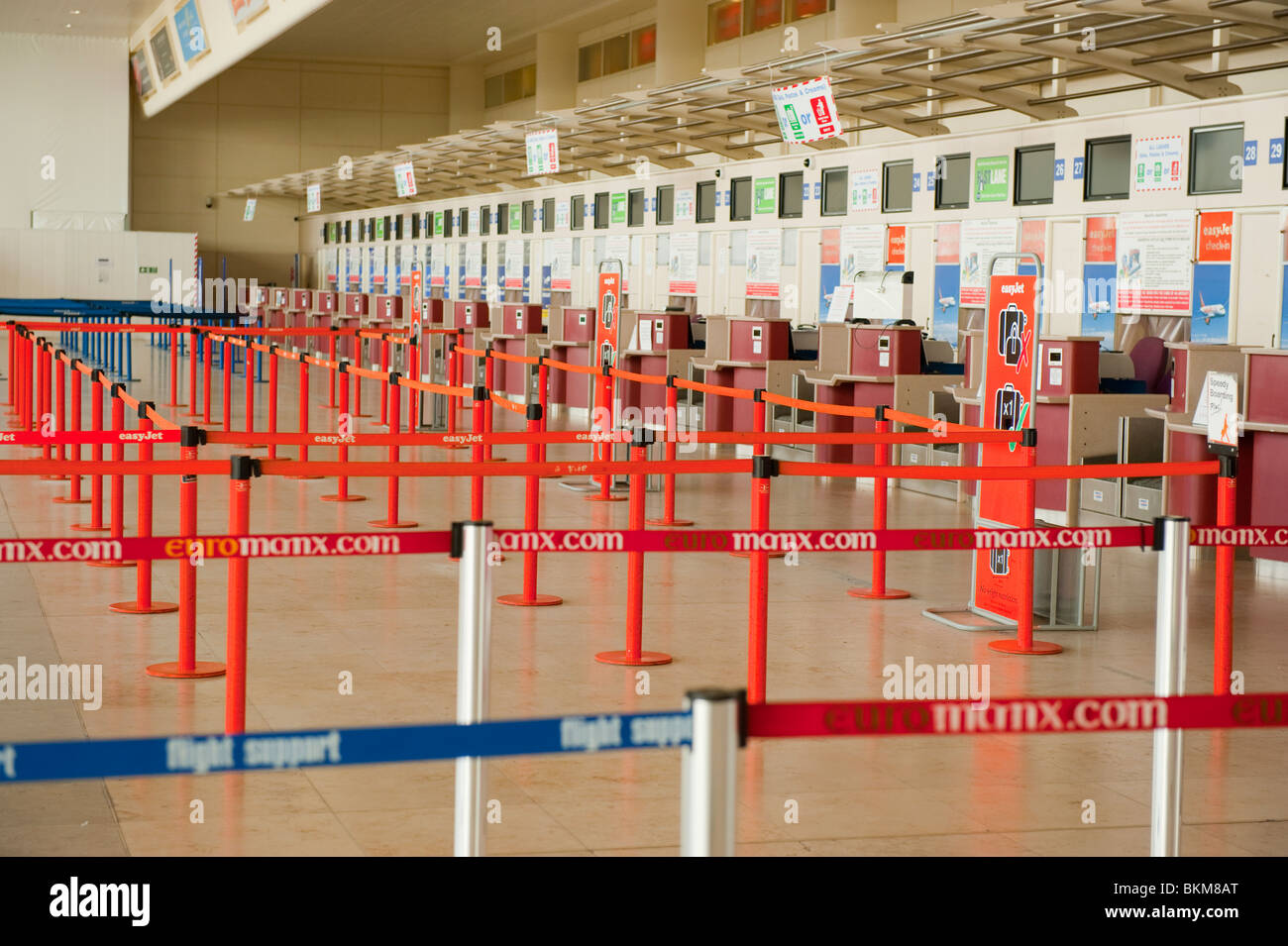 Airport check in desks empty flights canceled Stock Photo