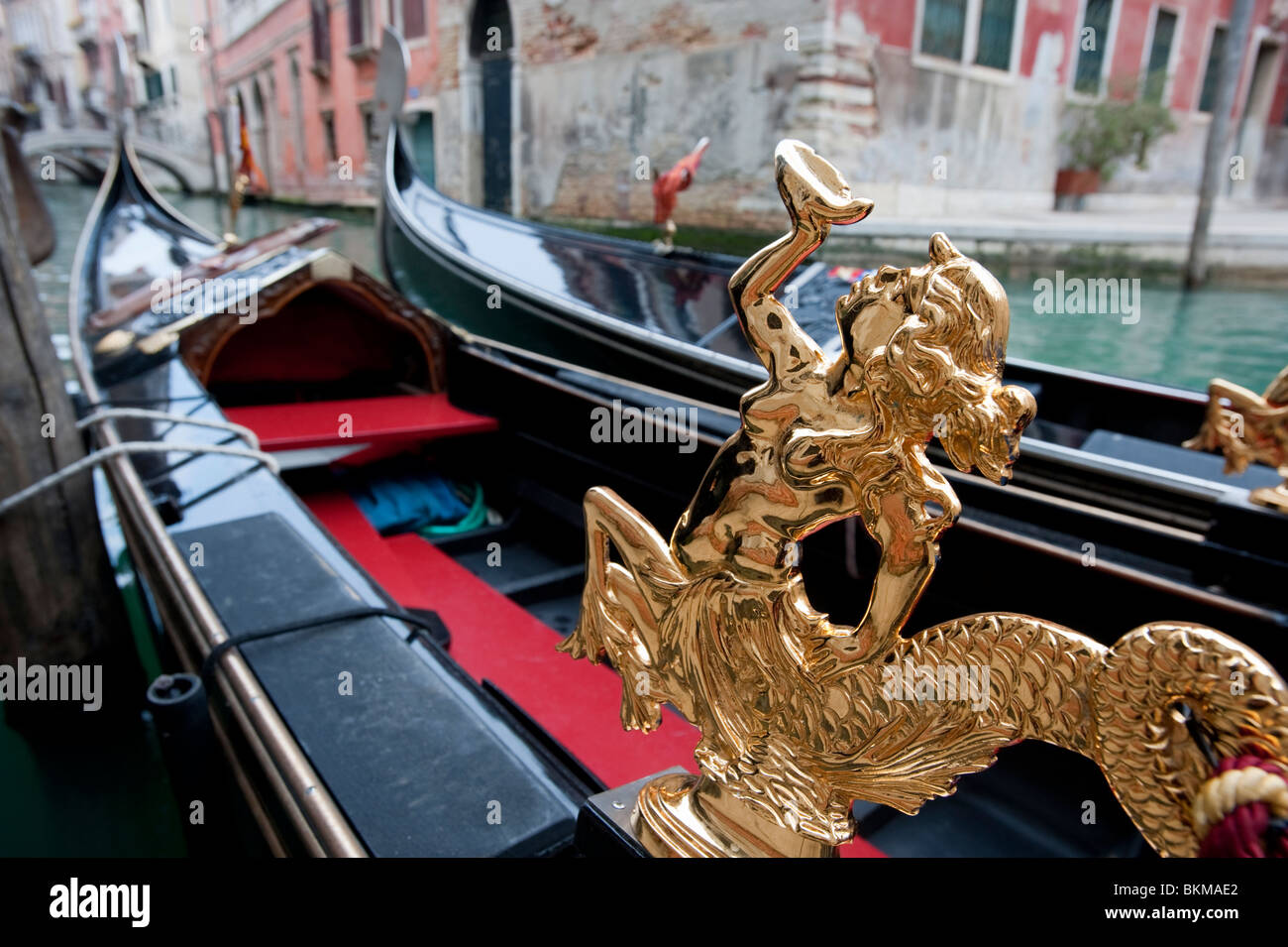 Close up of ornate gold statue on gondola in Venice Italy Stock Photo