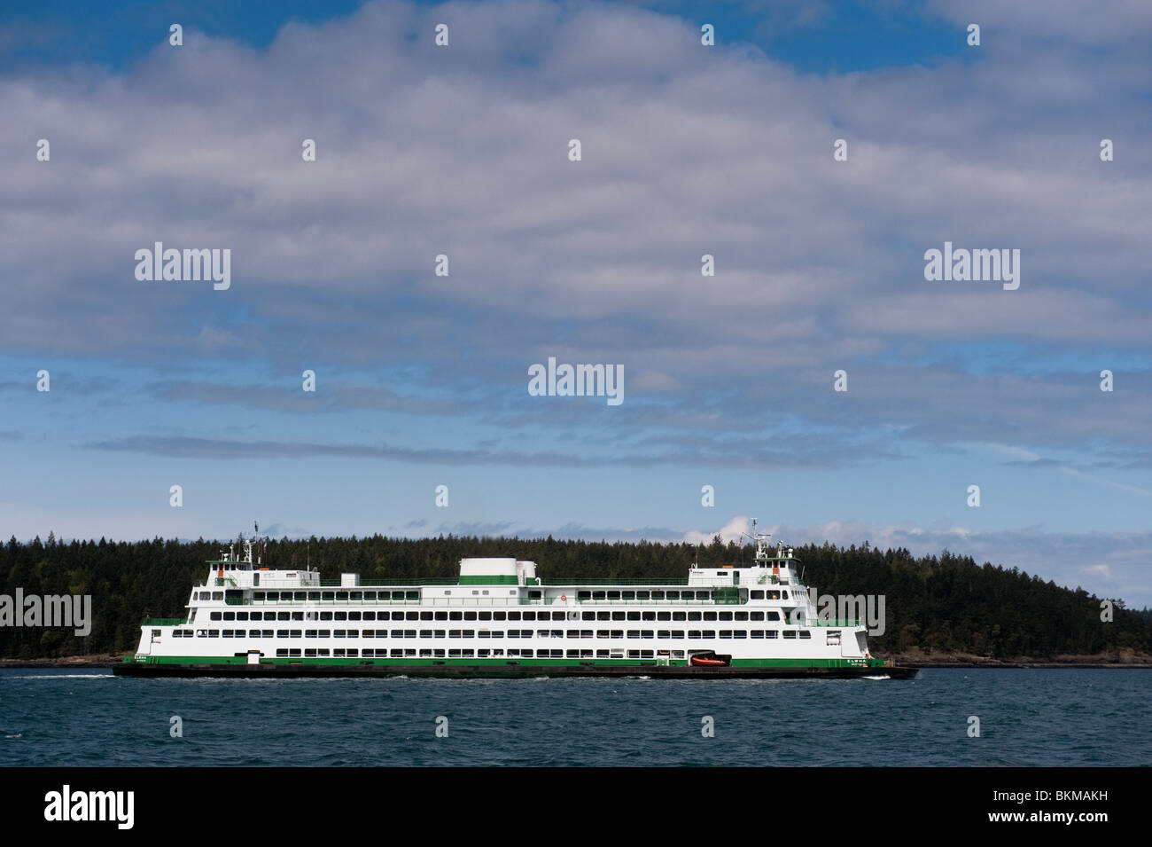A Washington State Ferry winds it's way through the San Juan Islands in ...