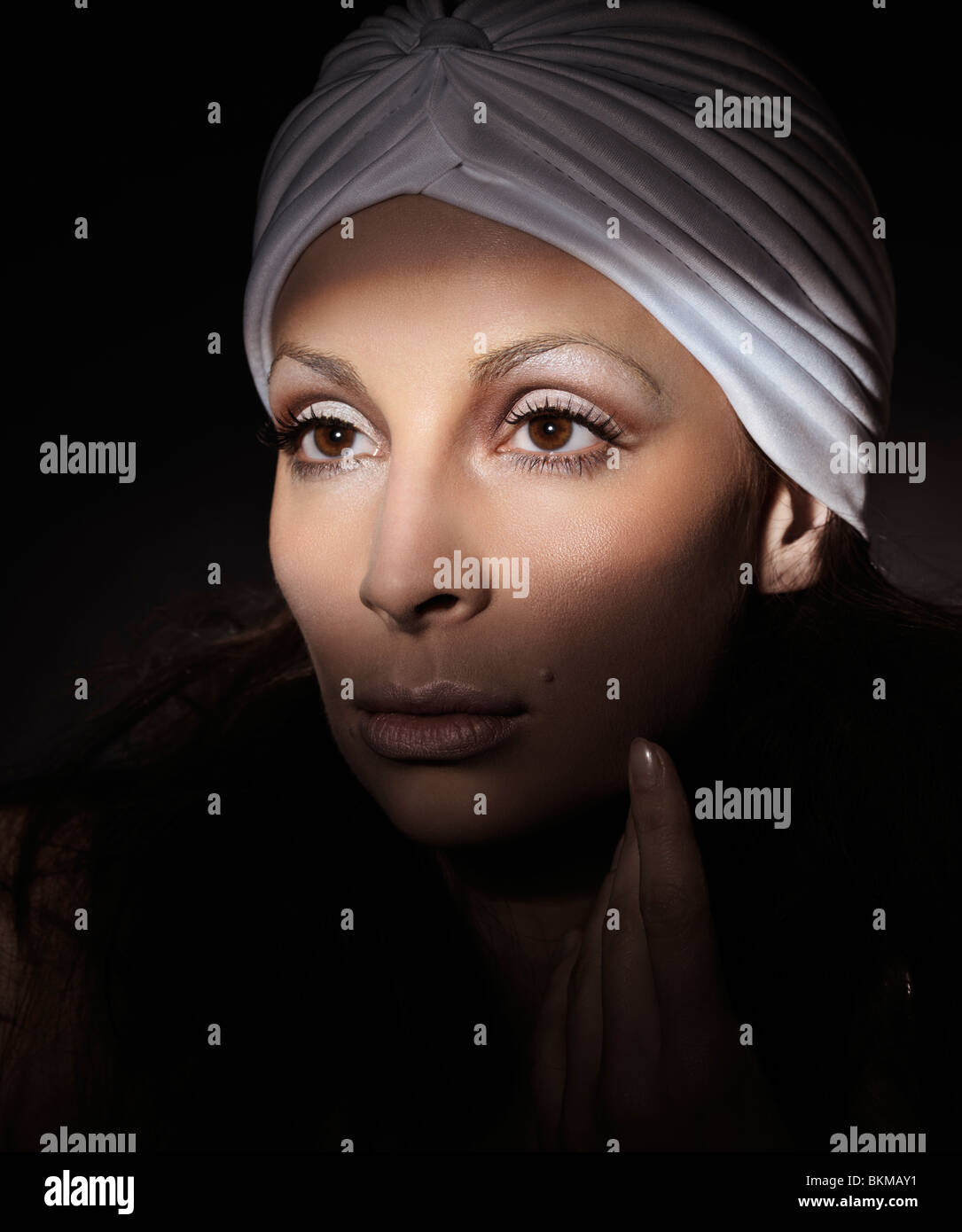 Light falling on a beautiful woman face artistic portrait Stock Photo
