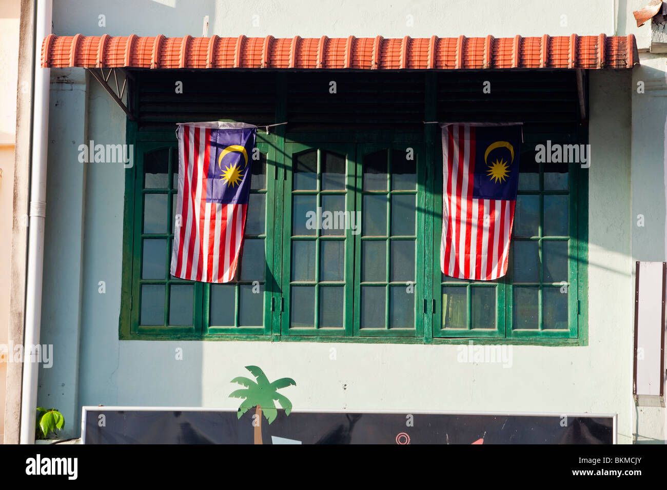 Malaysian flags on a chinese shophouse on the Main Bazaar. Kuching, Sarawak, Borneo, Malaysia. Stock Photo