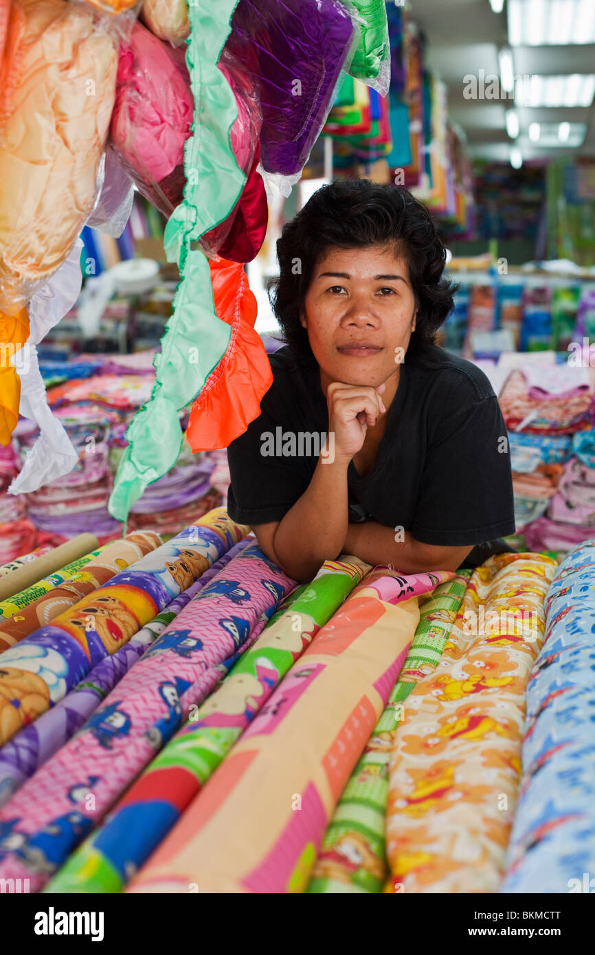 Portrait of a fabric merchant in Kuching, Sarawak, Borneo, Malaysia. Stock Photo