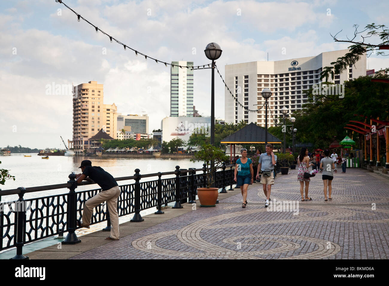 Afternoon stroll on the Kuching waterfront. Kuching, Sarawak, Borneo, Malaysia. Stock Photo