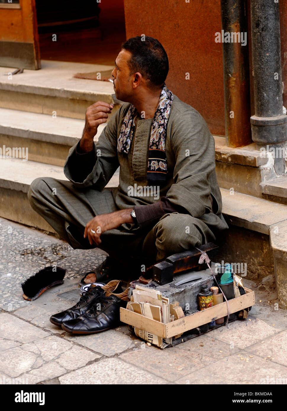 shoe shine man at the Spice Bazaar (Sharia al-Muizz street) ,khan el-khalili bazaar , islamic cairo , cairo , egypt Stock Photo