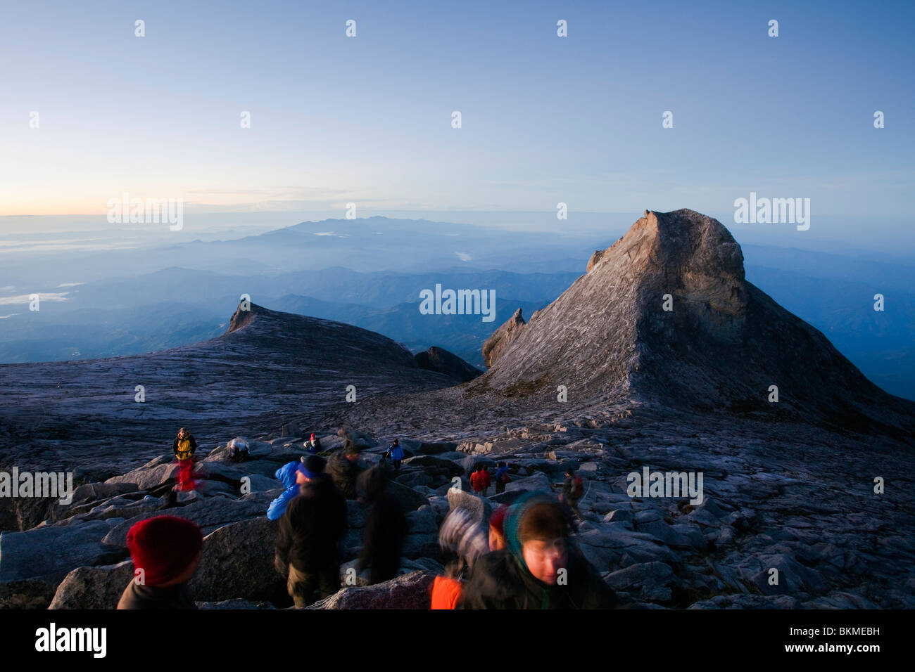 Climbers at Low's Peak, on the summit of Mt Kinabalu at dawn. Kinabalu National Park, Sabah, Borneo, Malaysia. Stock Photo