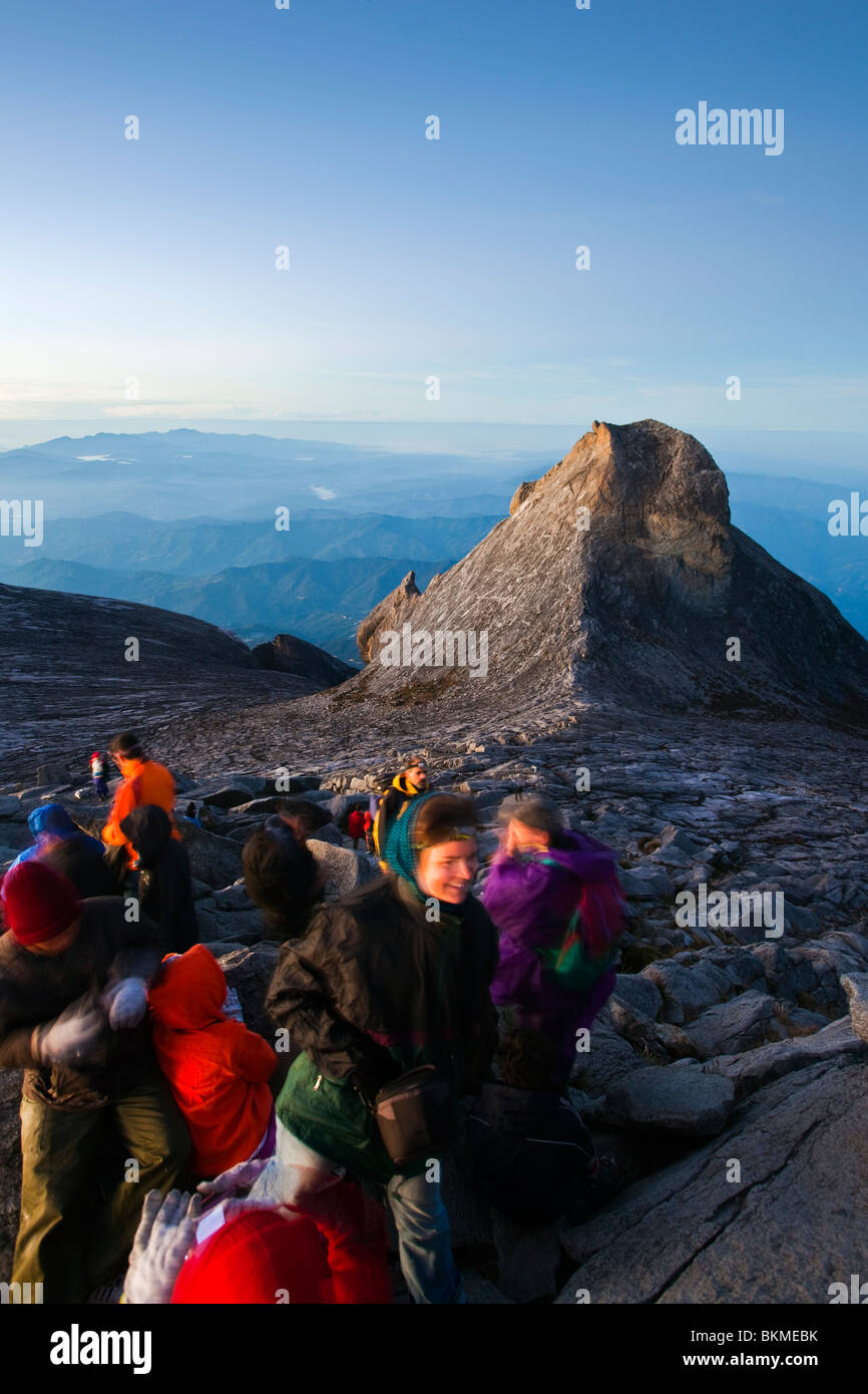 Climbers at Low's Peak, on the summit of Mt Kinabalu at dawn. Kinabalu ...
