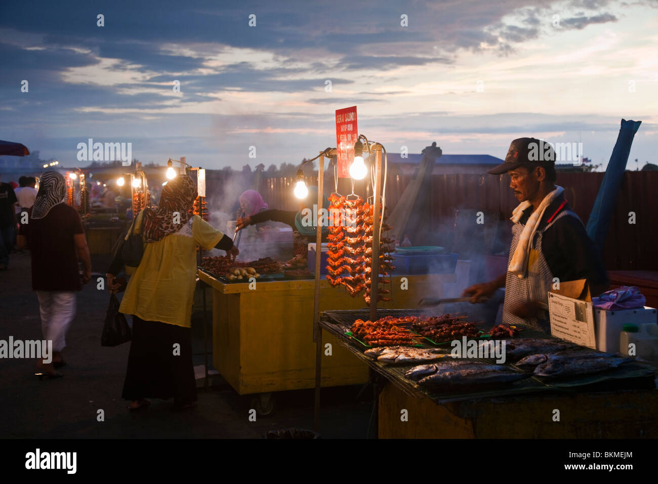 Filipino barbeque hawker stalls at the Night Market on the KK waterfront. Kota Kinabalu, Sabah, Borneo, Malaysia. Stock Photo