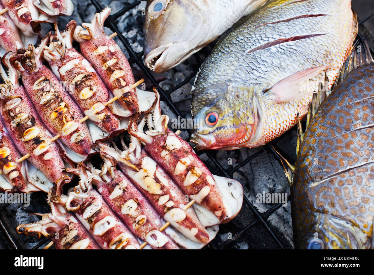 Seafood grilling over hot coals at the Filipino Barbeque Night Market. Kota Kinabalu, Sabah, Borneo, Malaysia. Stock Photo