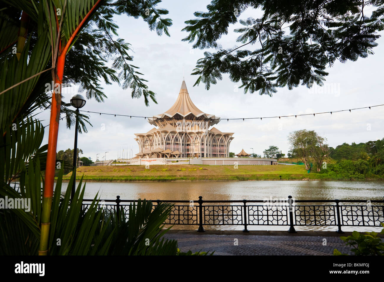 View across to the Sarawak State Legislative Assembly Building from the riverside promenade. Kuching, Sarawak, Borneo, Malaysia. Stock Photo