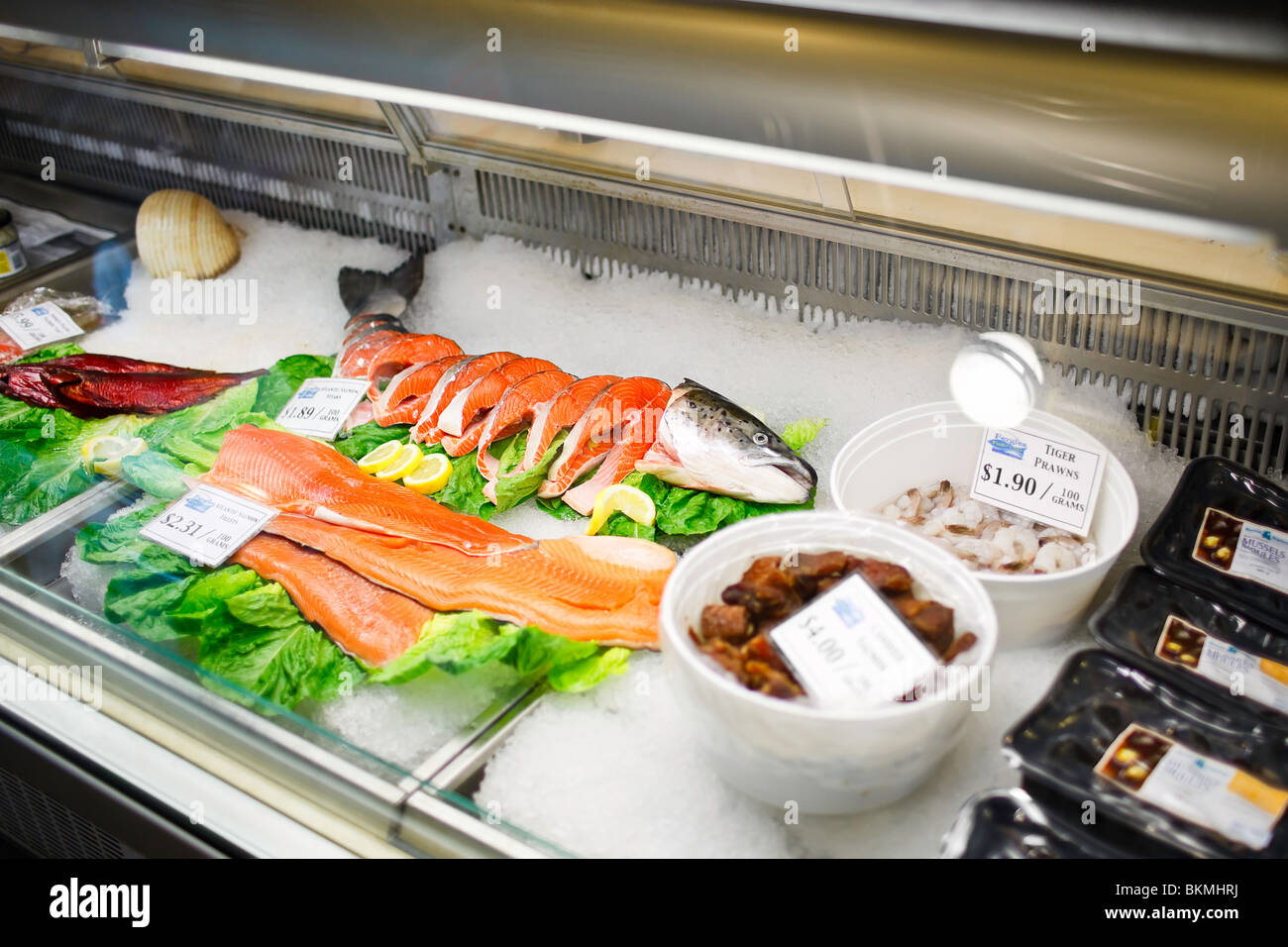Fresh seafood on ice at a Seafood Market. Stock Photo