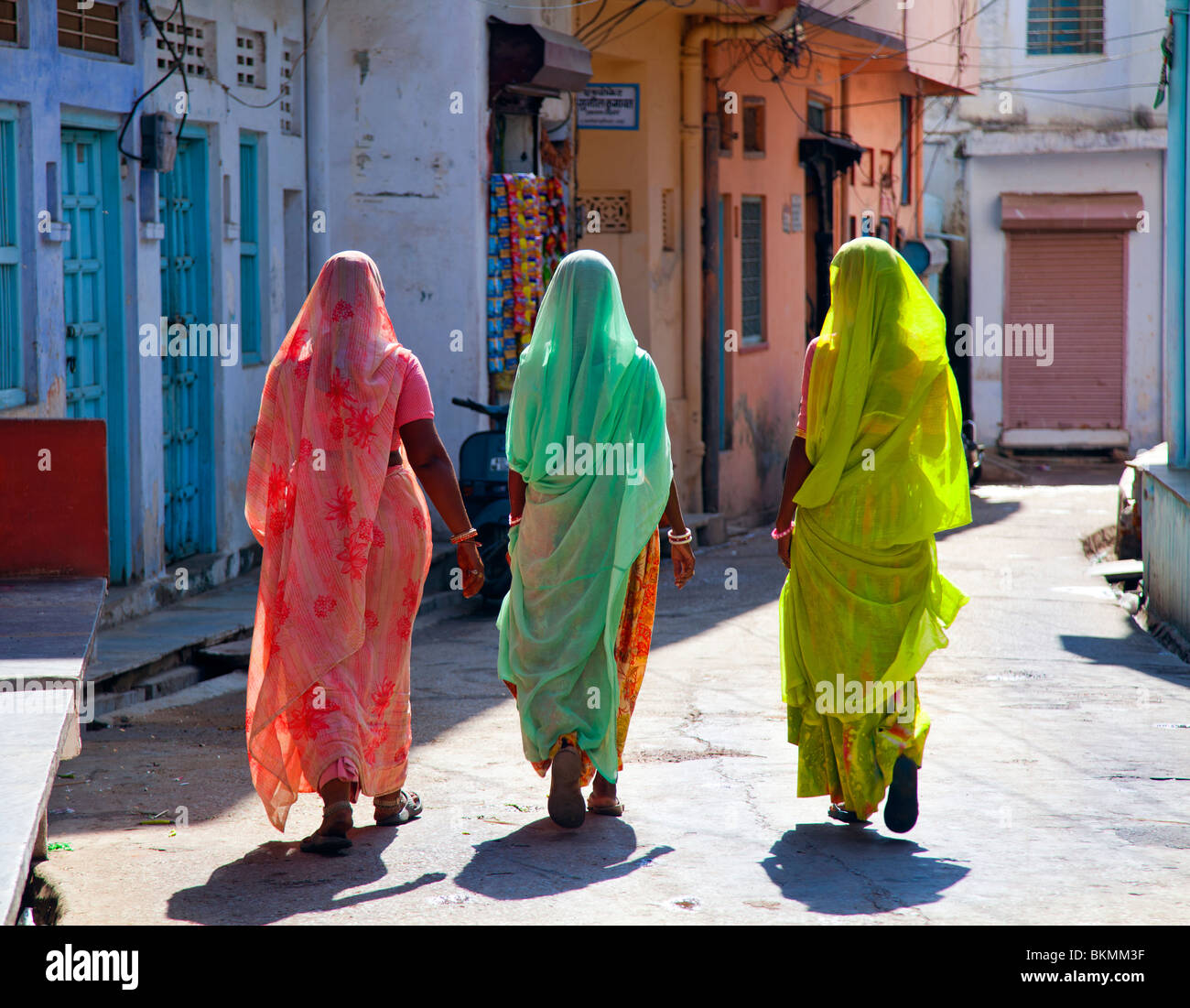 India, Rajasthan, Jodhpur, three women in saris walking away from camera Stock Photo