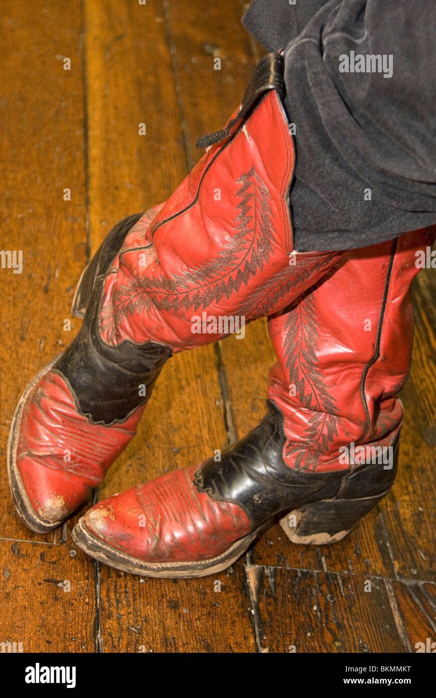 Authentic, well worn cowboy boots worn by a local man who dresses up as a sheriff for tourists in Placerville, CA Stock Photo