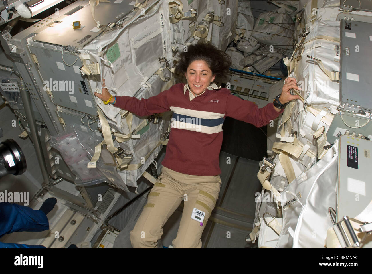 Astronaut Nicole Stott weightless and floating Leonardo Multi-Purpose Logistics Module STS-128 Space Shuttle Mission 5 Sept 2009 Stock Photo