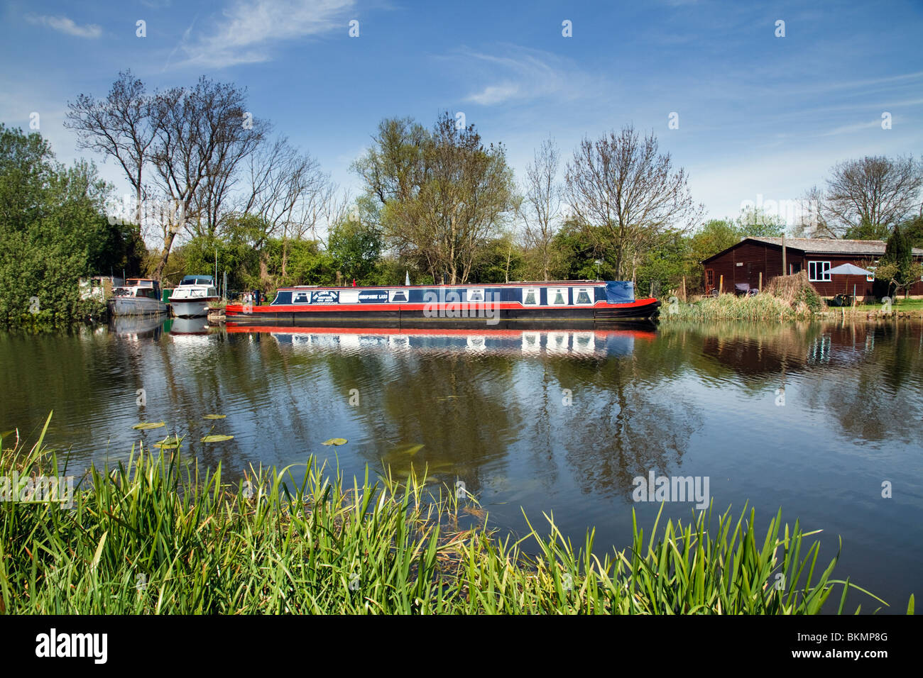 The River Ouse A Longboat Barge Near Houghton Village In Cambridgeshire, East Anglia England The United Kingdom UK Stock Photo