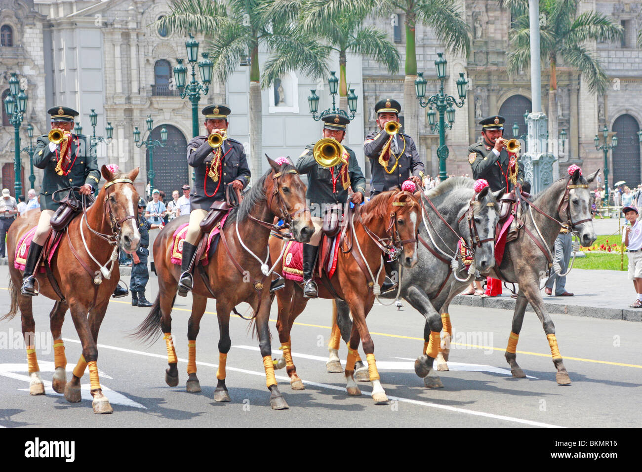 Mounted police buglers are part of the daily  changing of the guard at the Palacio de Gobierno in the historic center of  Lima, Stock Photo