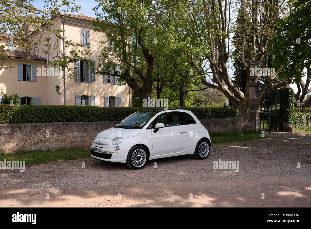 Fiat 500 parked by a Chateau la Lieue Provence  in France Stock Photo