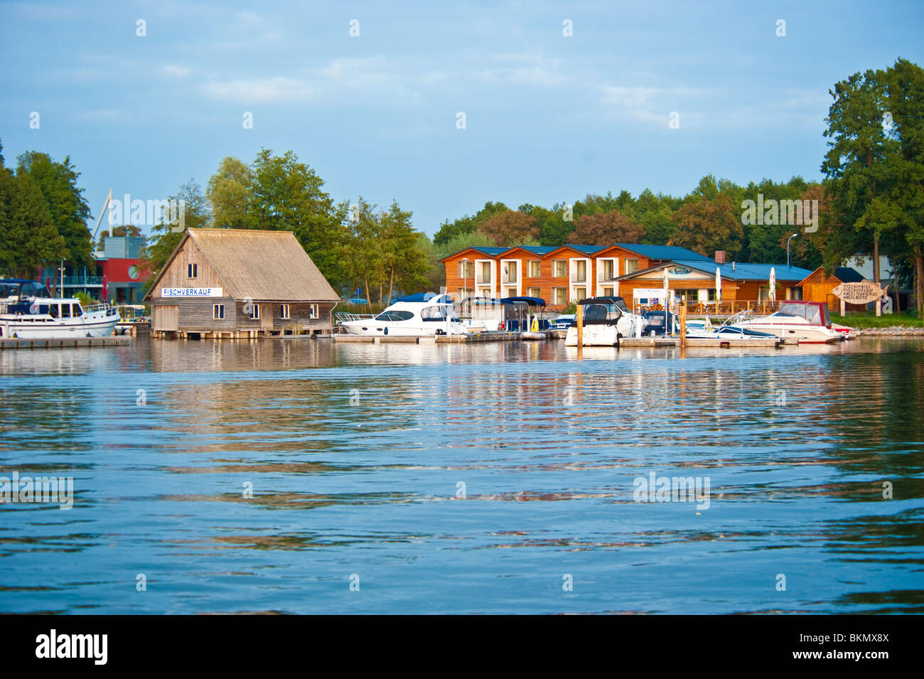 Houses and stages with yachts at marina Eldenburg near Mueritz, Mecklenburg Western-Pomerania, Germany Stock Photo