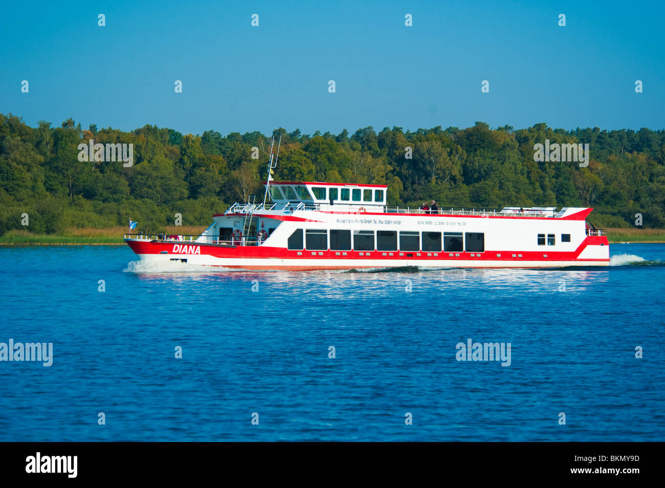 Red and white tourist ship for cruising, Mueritz, Mecklenburg Western-Pomerania, Germany Stock Photo