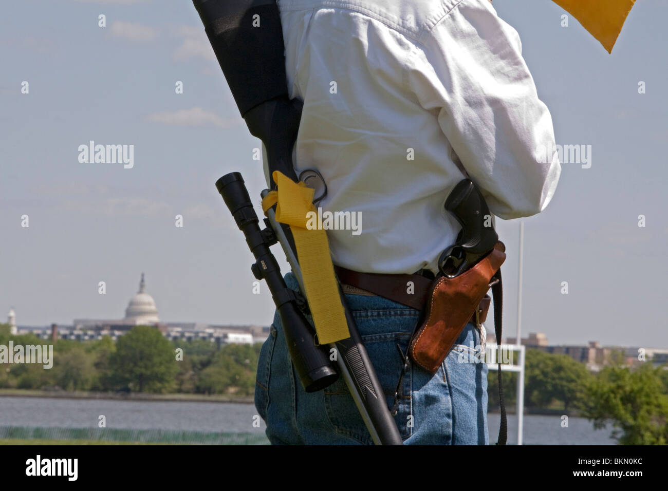 Progun activists openly carry firearms in a progun rally Stock Photo