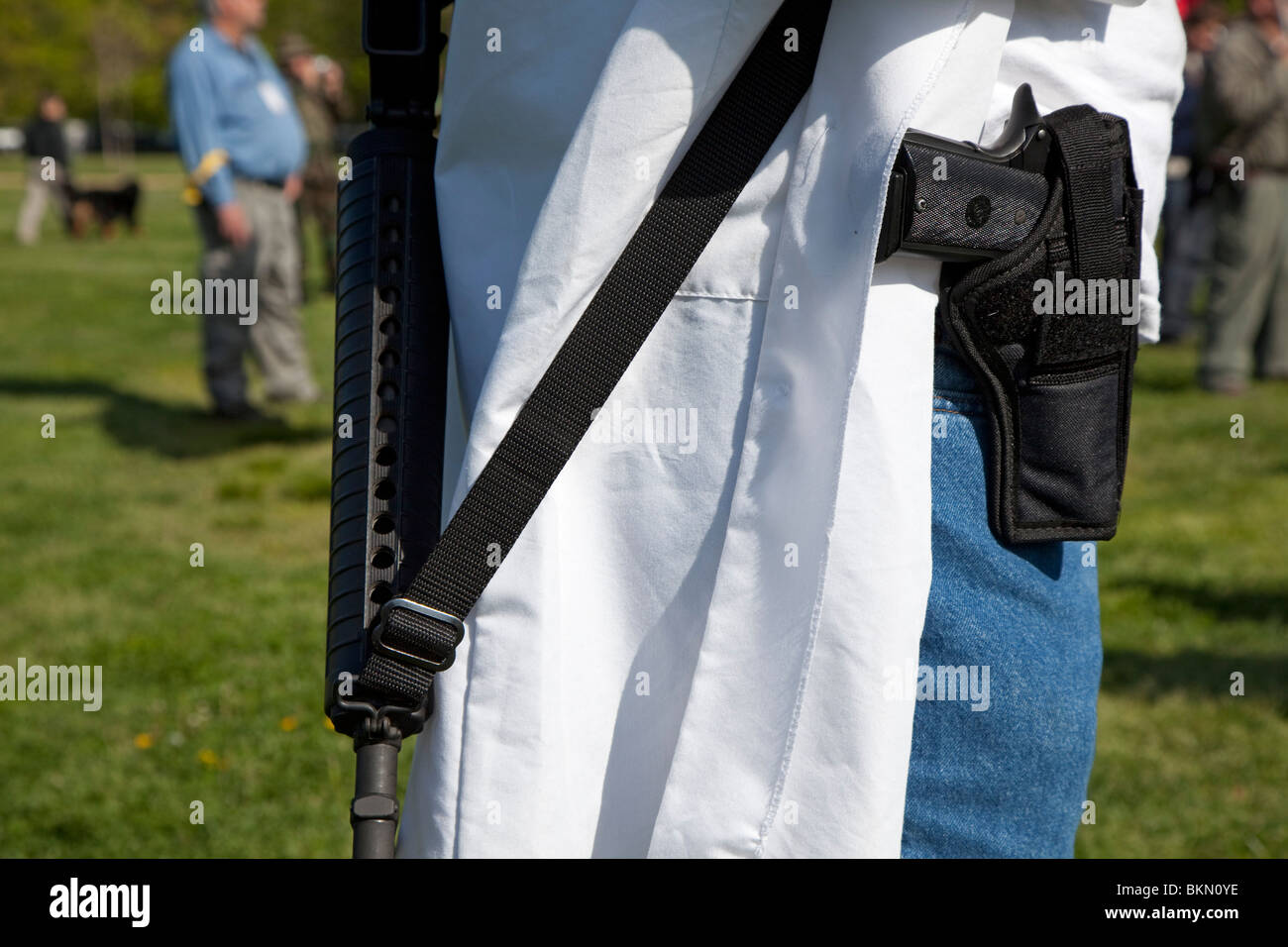 Progun activists openly carry firearms in a progun rally Stock Photo