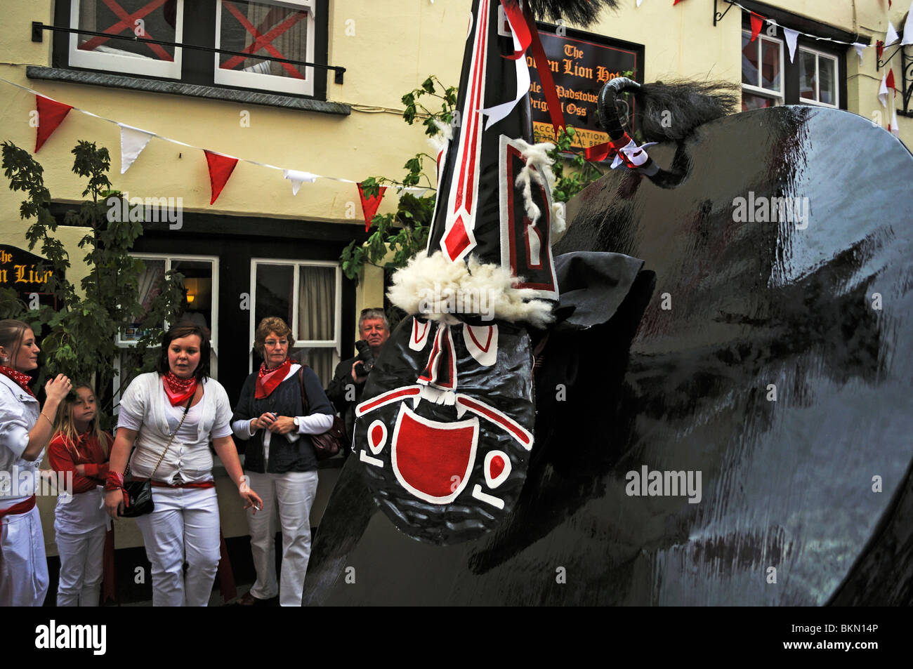 the " red oss " dancing on "obby oss" day in padstow, cornwall, uk Stock Photo