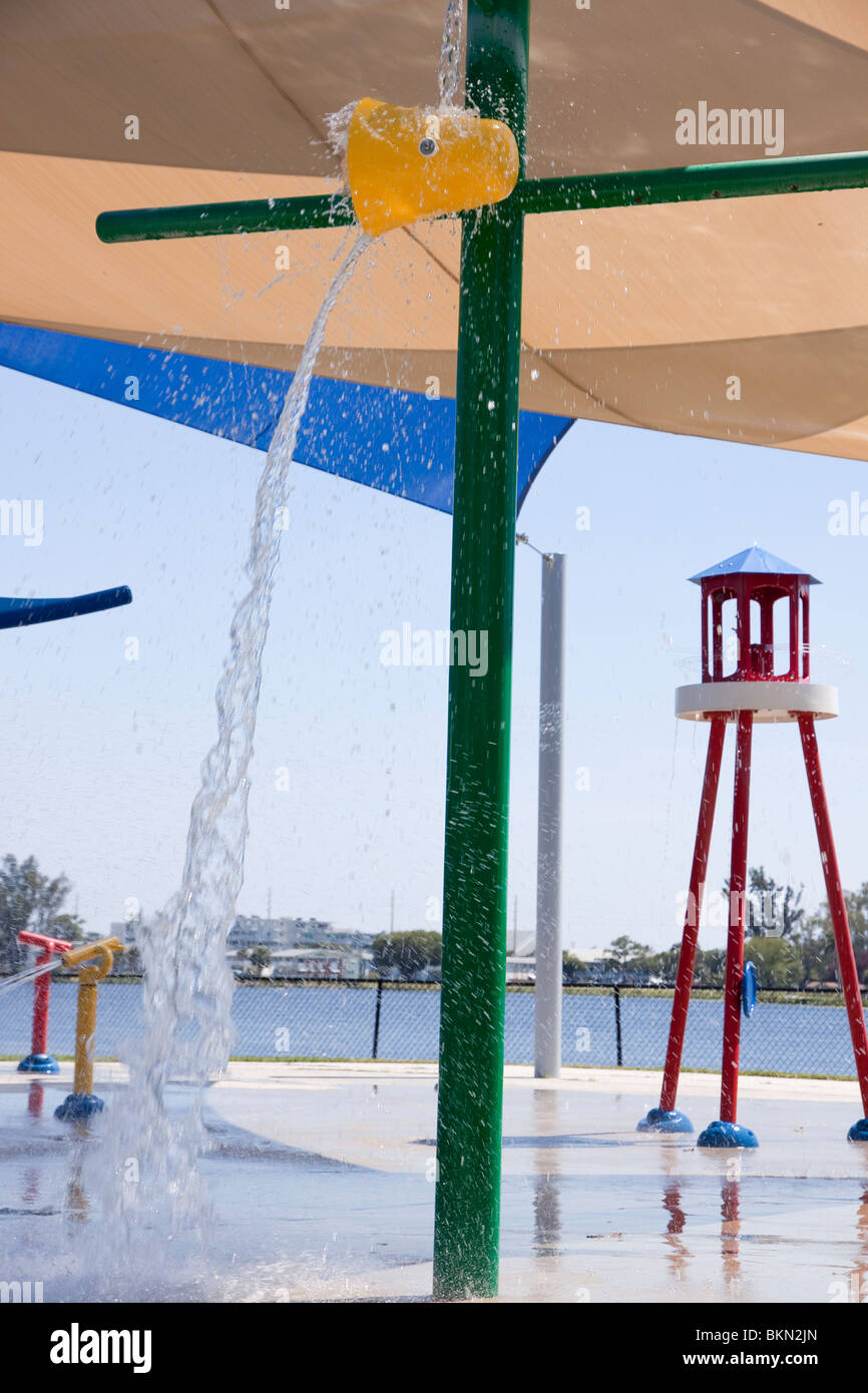 Bucket of water tipping in a water park. Stock Photo