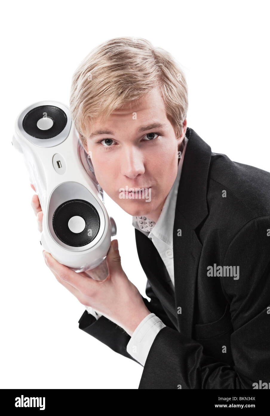 Young blond handsome man holding boombox; isolated on white Stock Photo
