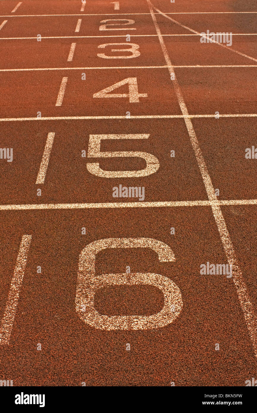 Numbered lanes of running track Stock Photo