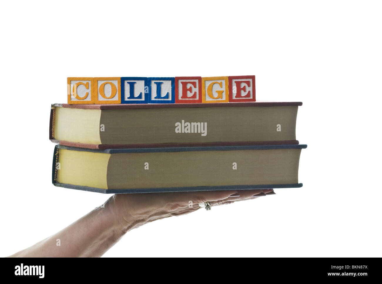 Woman holding children's blocks that spell 'COLLEGE' Stock Photo