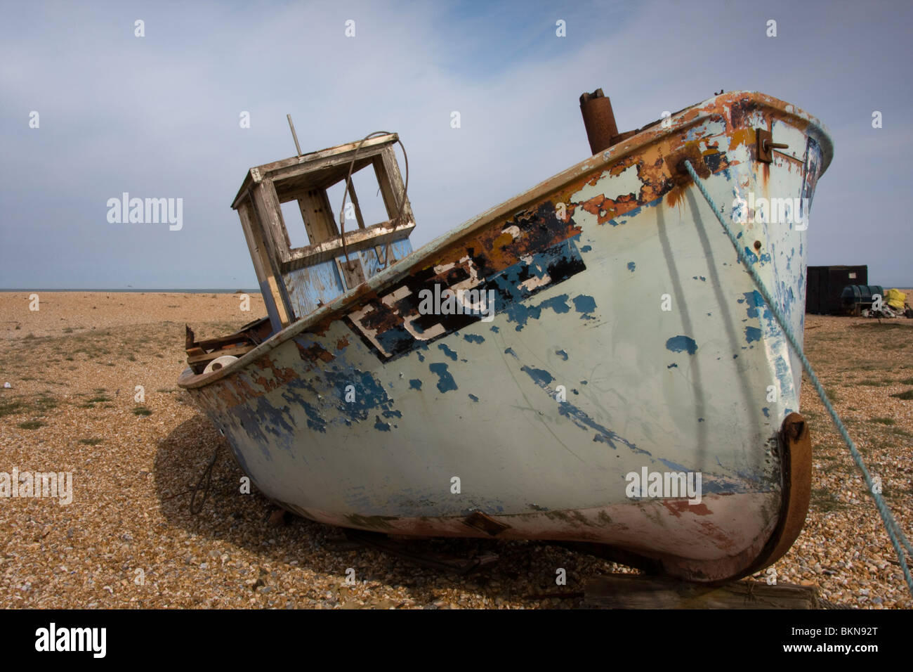 Old fishing boats lay deserted on the beach of Dungeness in Kent Stock ...