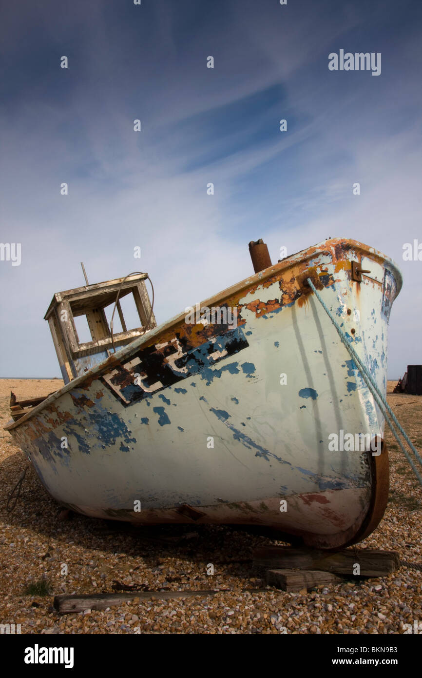 Old fishing boats lay deserted on the beach of Dungeness in Kent Stock ...