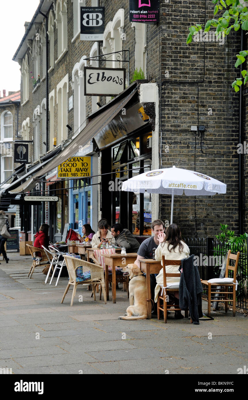 People eating outside Elbows Cafe Hackney London England UK Stock Photo