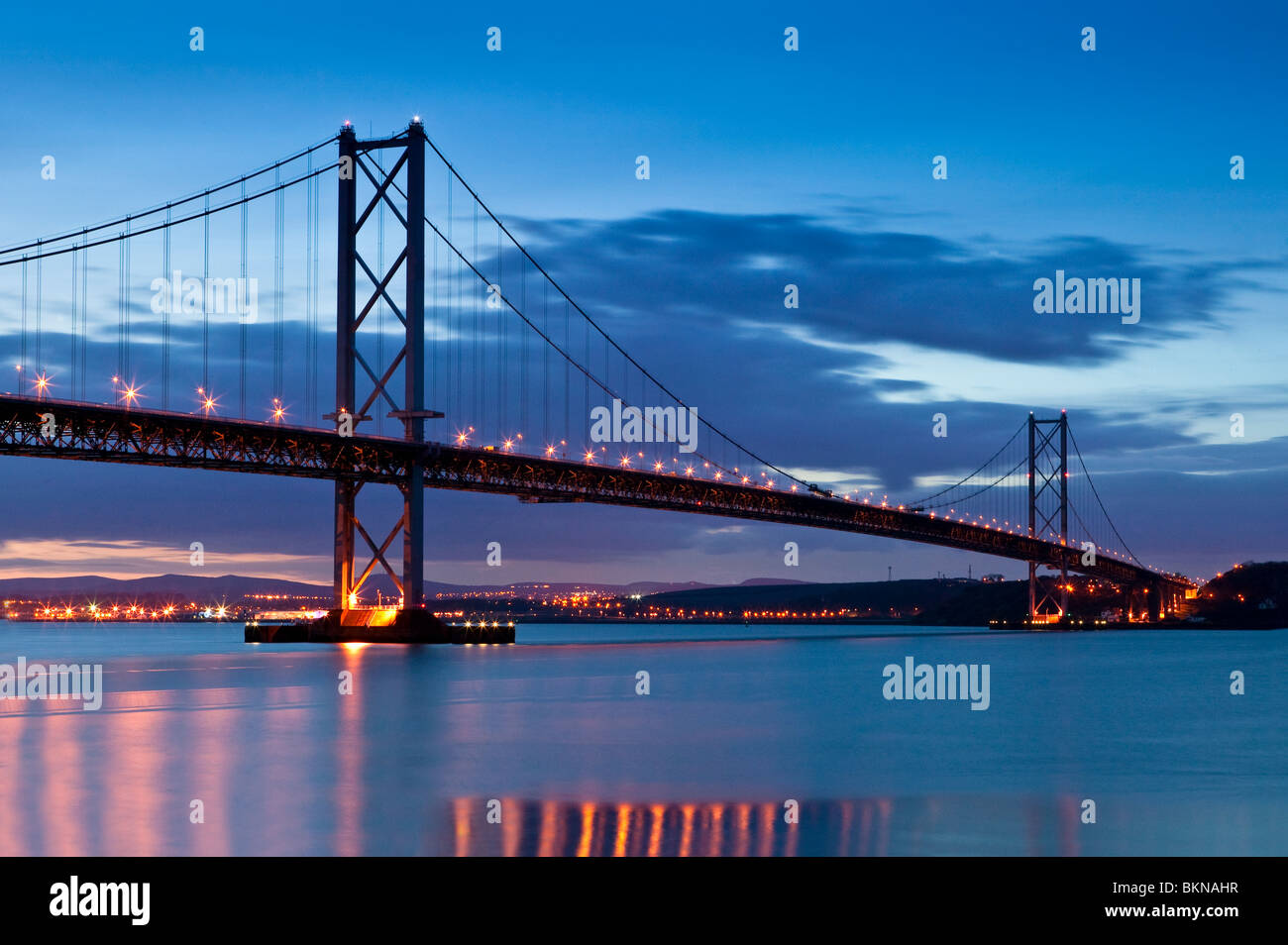 The Forth Road Bridge at twilight, just after sunset, as viewed from the Edinburgh side, South Queensferry. Stock Photo