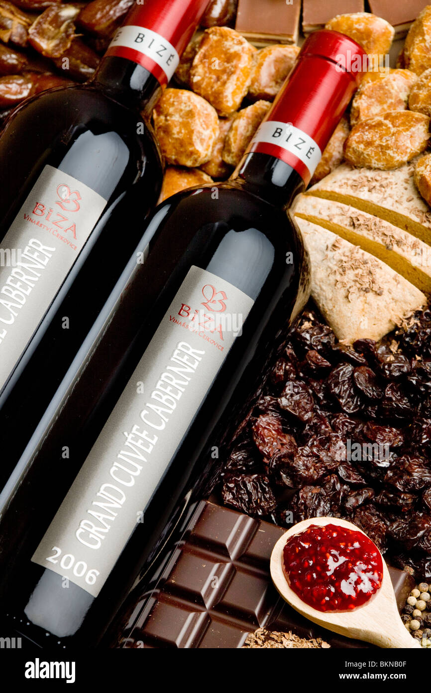 bottles of wine with dried fruit, chocolate and gingerbread Stock Photo