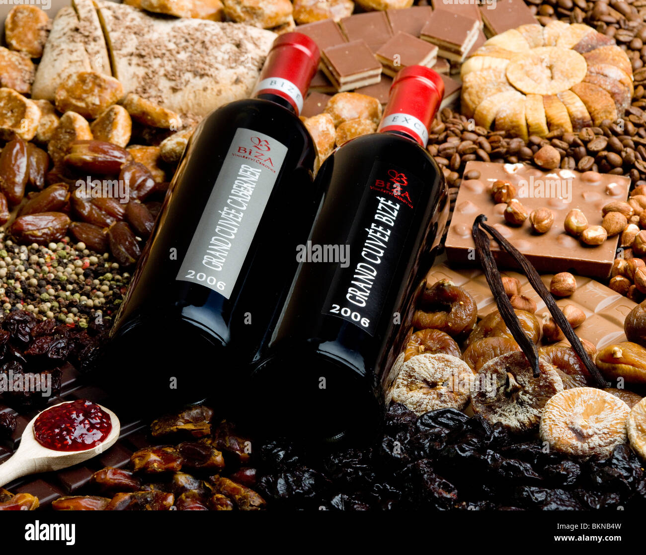 bottles of wine with dried fruit, chocolate and gingerbread Stock Photo