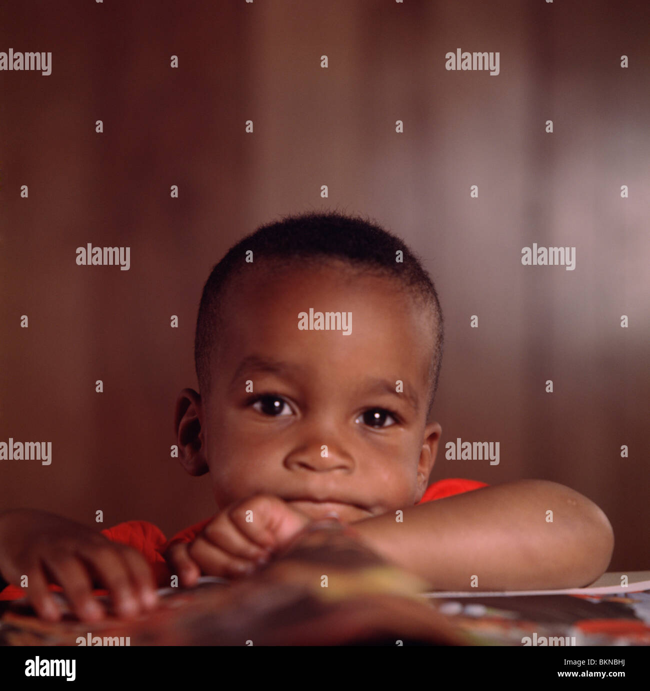 Young African American boy looking at the camera Stock Photo - Alamy