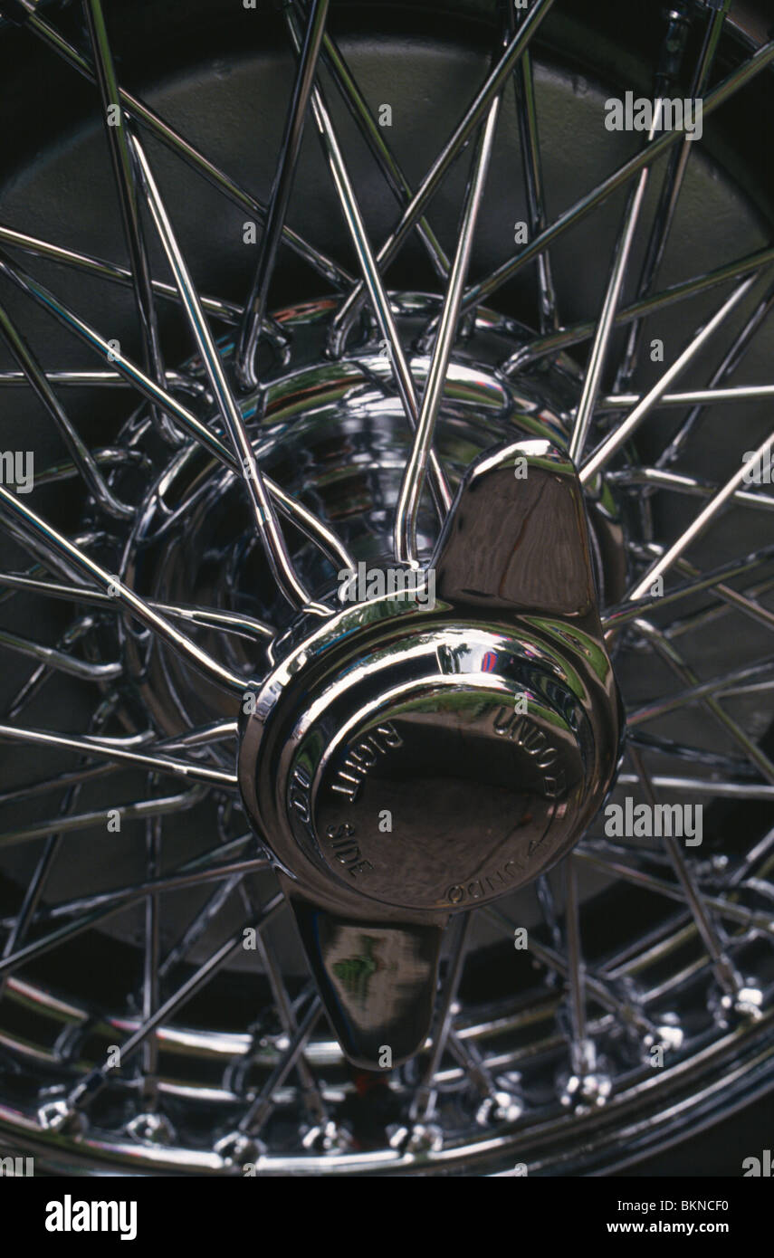 Wire spoked wheel hubcap detail Stock Photo Alamy