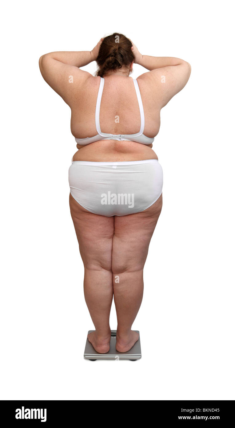 women with overweight in underwear from behind on scales Stock Photo - Alamy