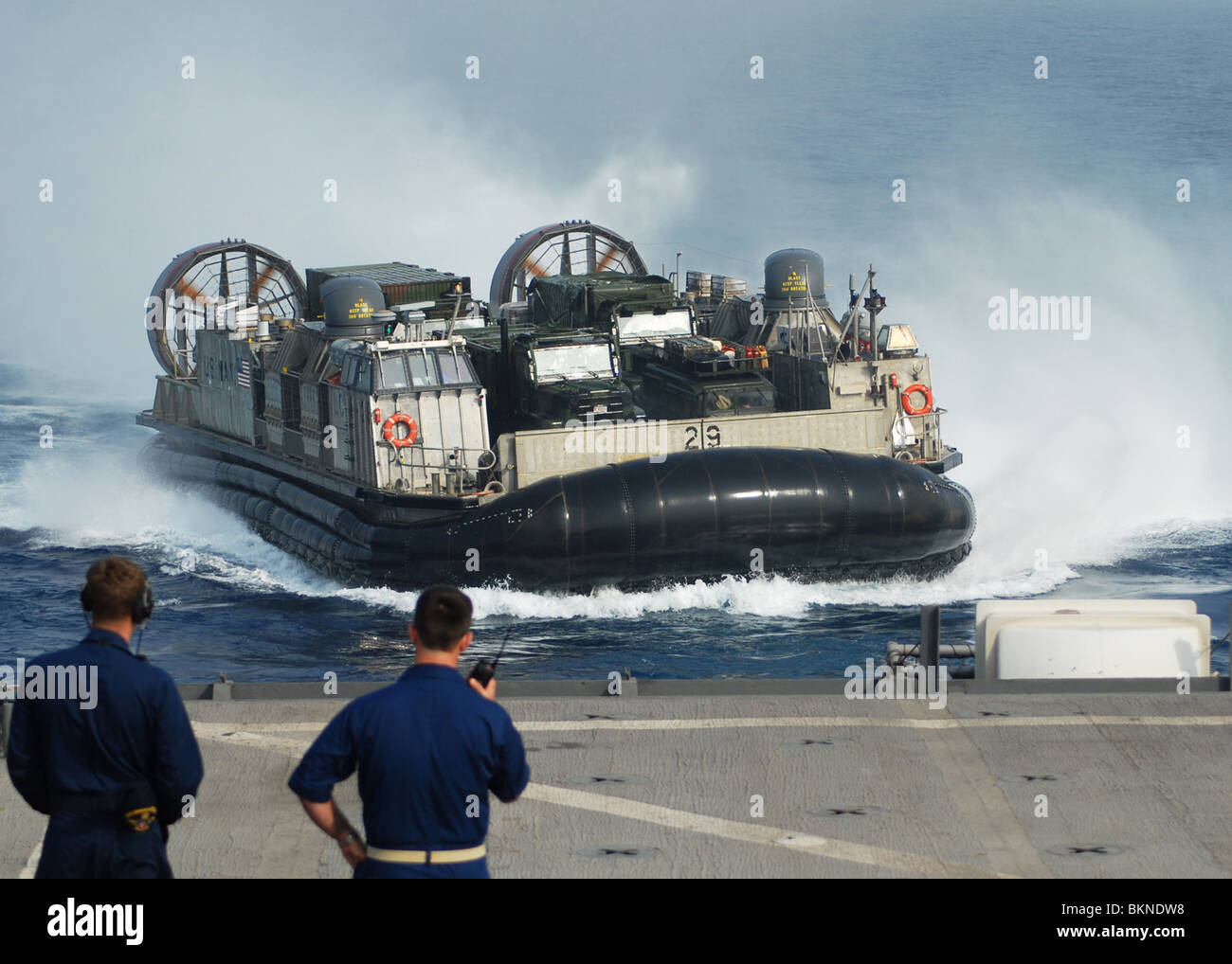 SEA OF JAPAN Sailors observe the Landing Craft Air Cushion (LCAC) 29 assigned to Assault Craft Unit (ACU) 5 Stock Photo