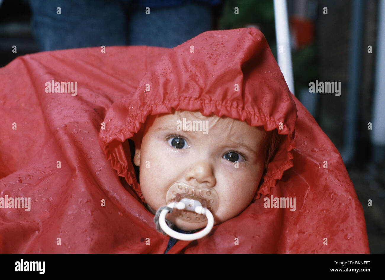baby in raincoat