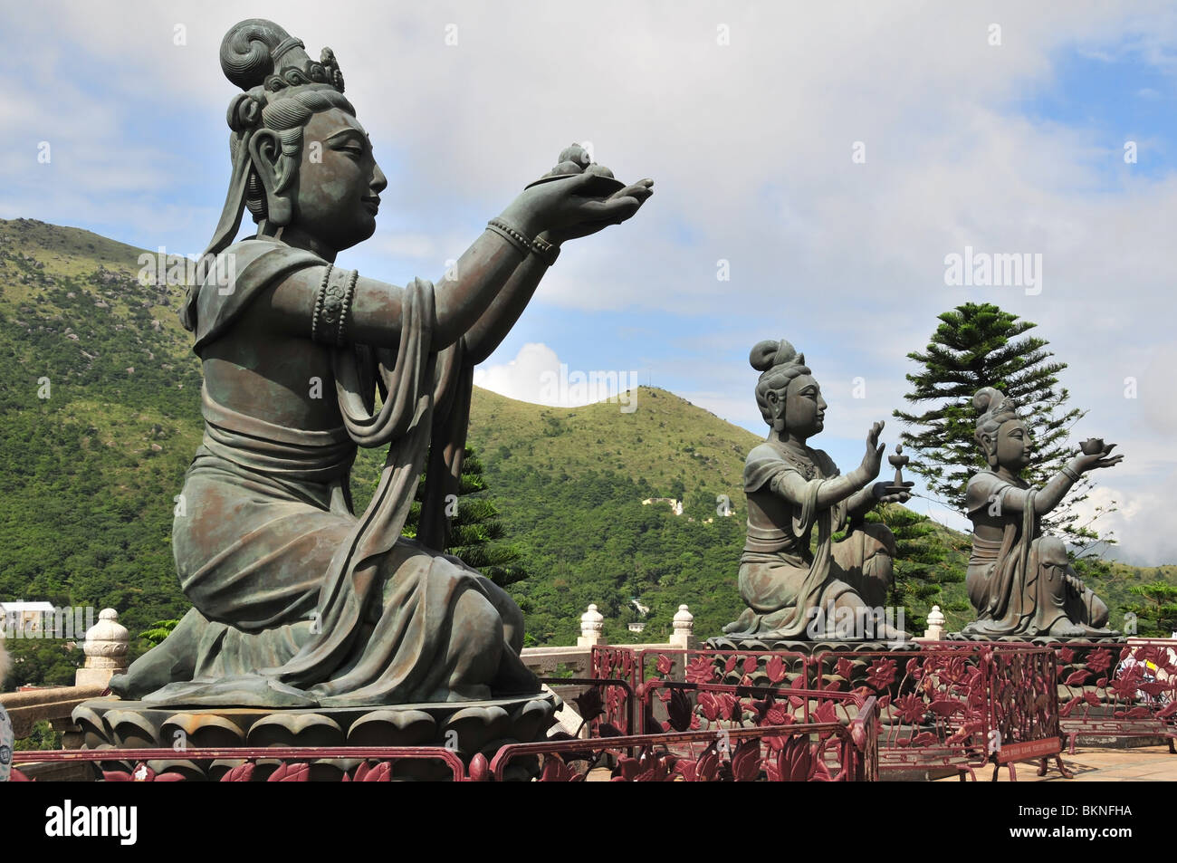 Three bronze Deva statues offering fruit, lamp, flowers to the Tian Tan ...