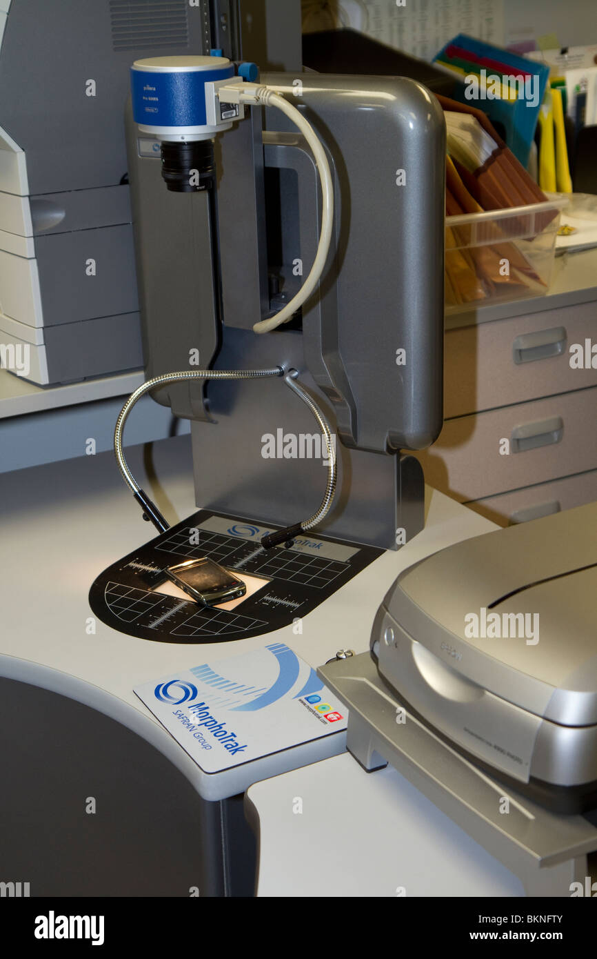 Set-up to scan fingerprints off a cell phone and searching those prints in AFIS. Nebraska State Patrol Crime Laboratory. Stock Photo